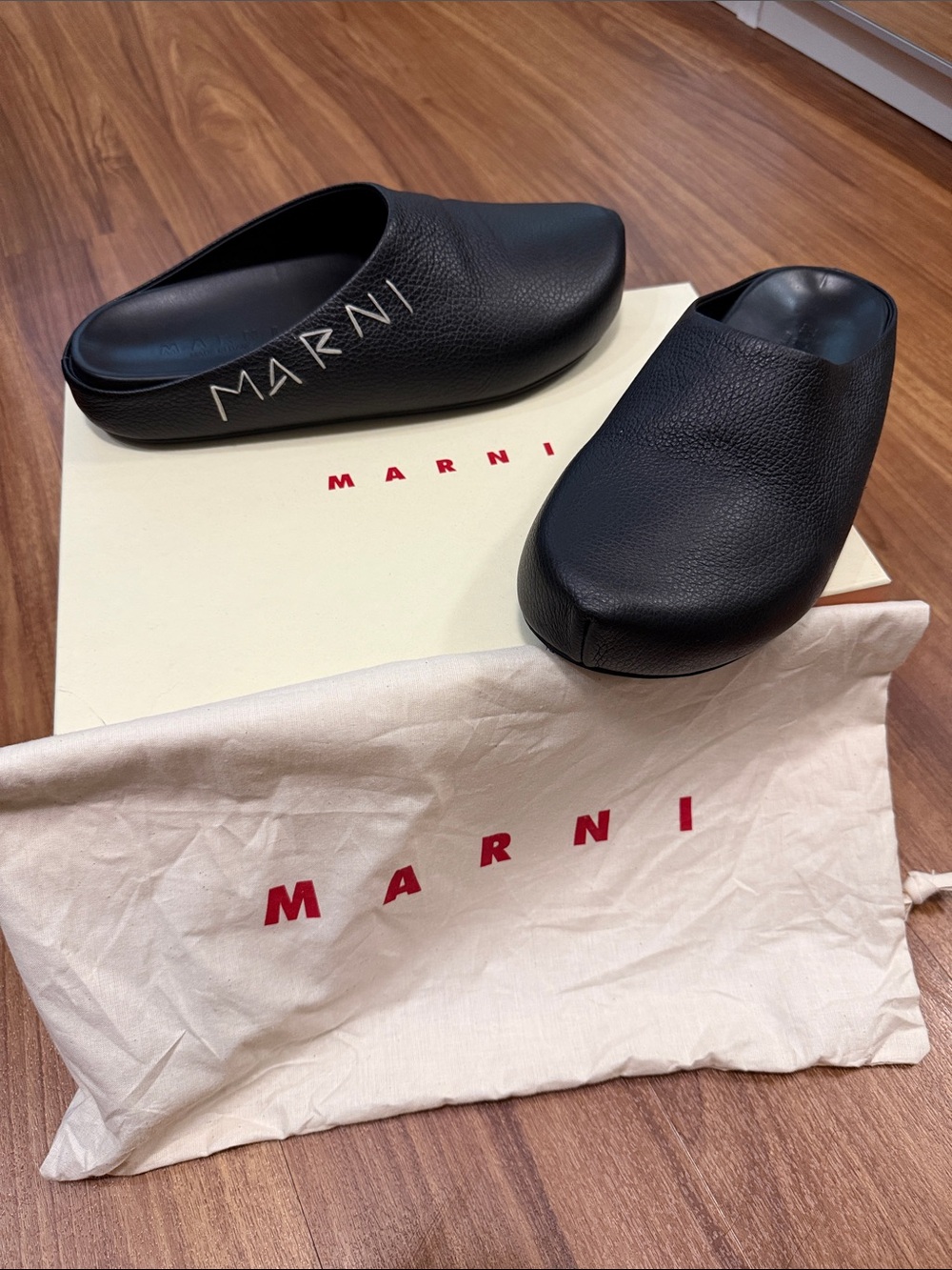 Marni Black Pebbled Leather Slip-On Clogs with White Logo Script